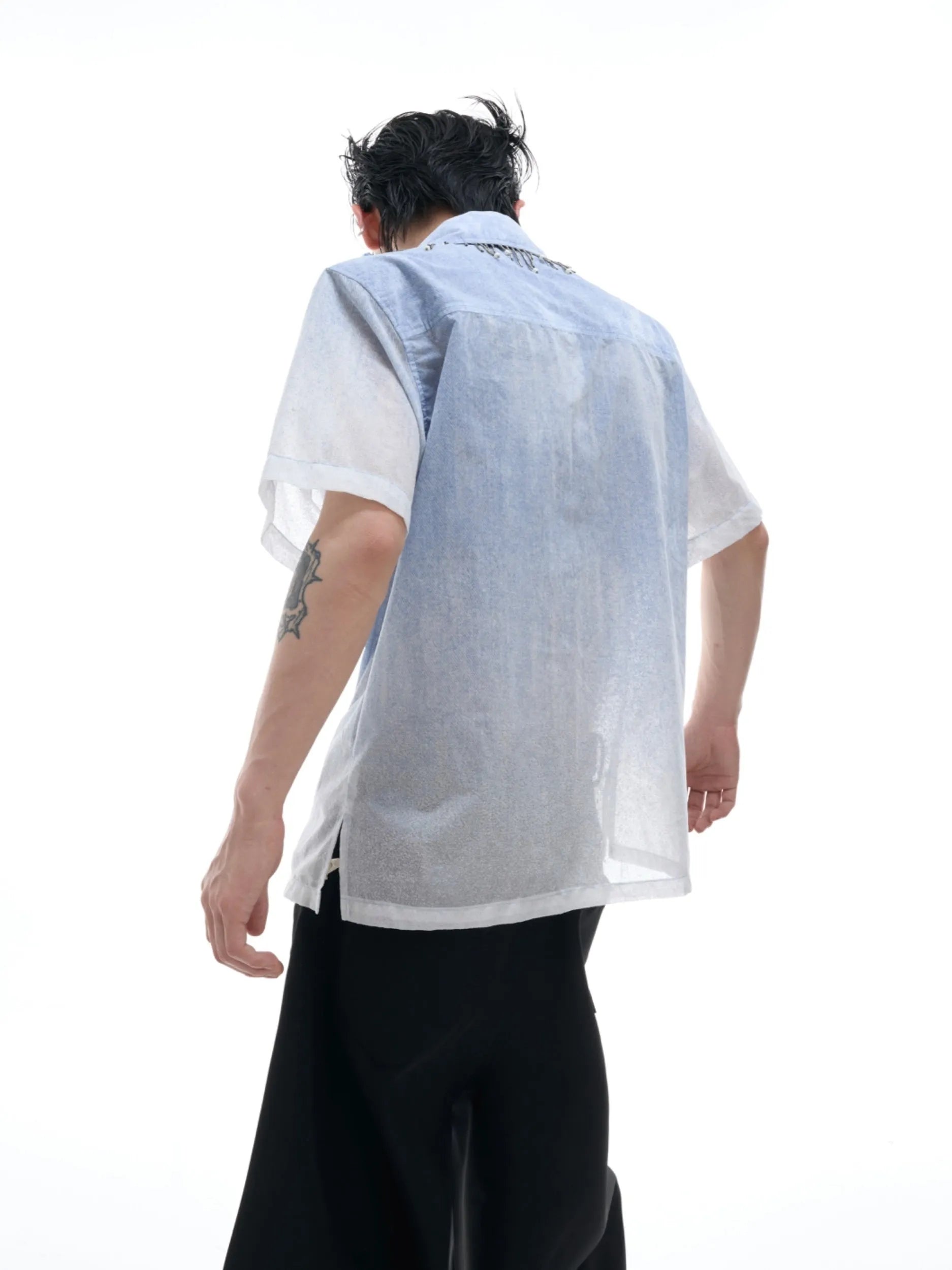 Blue and white gradient loose short shirt with half sleeves on a hanger.
