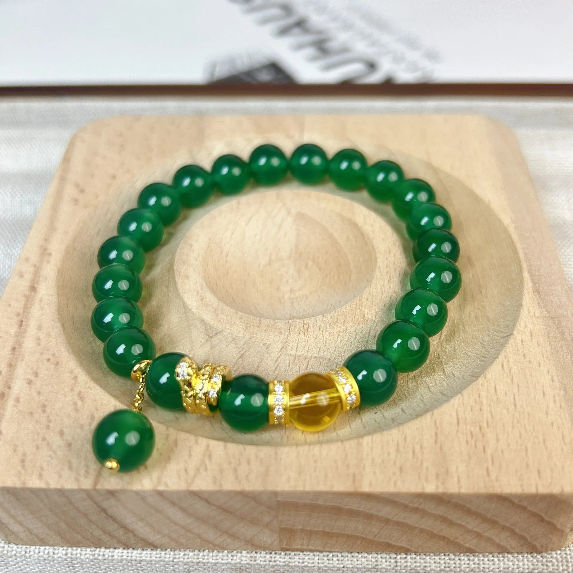 Handcrafted green chalcedony wealth snake and red agate beaded bracelet with copper components.
