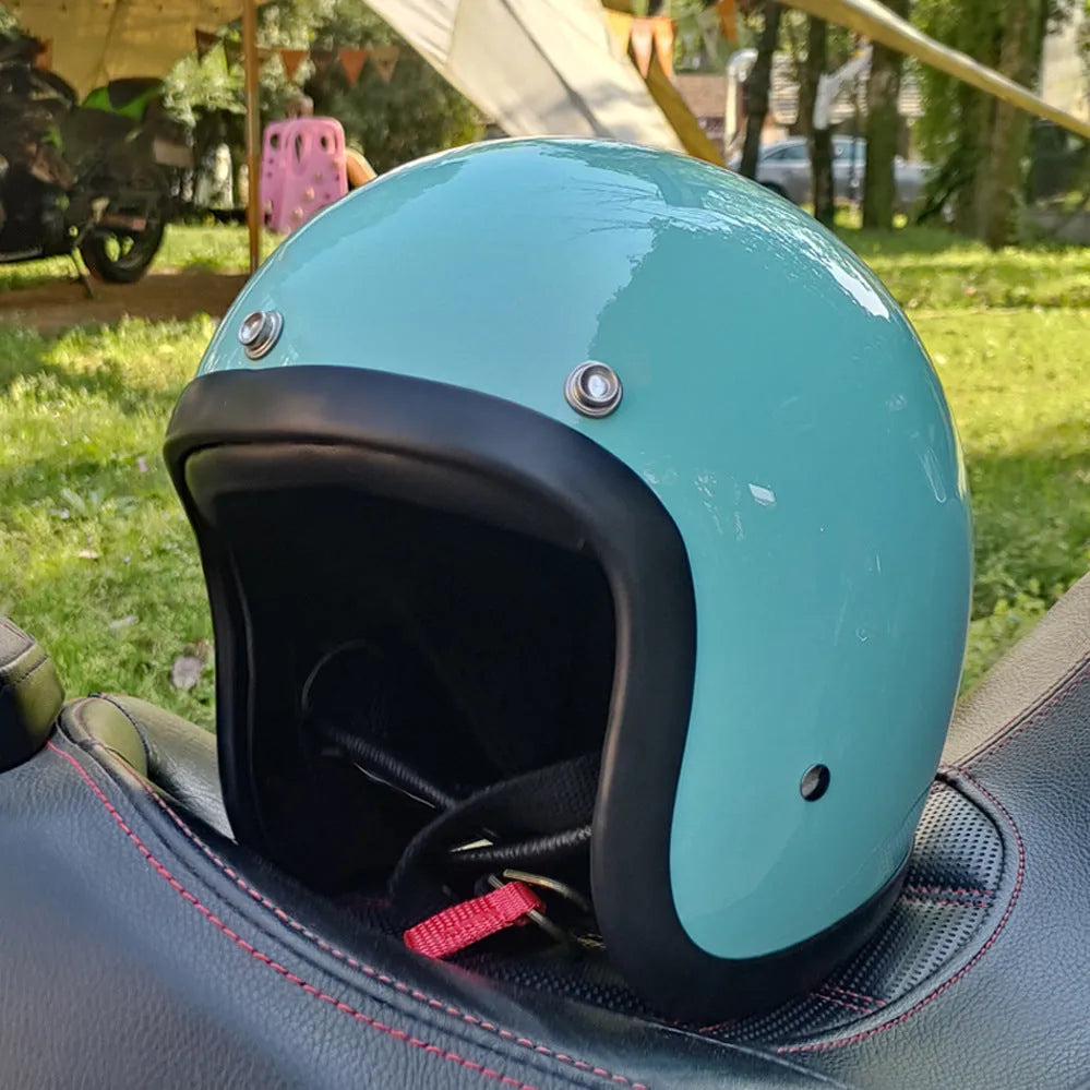 Cement Grey retro open-face motorcycle helmet with a smooth glass fibre shell on a plain background.