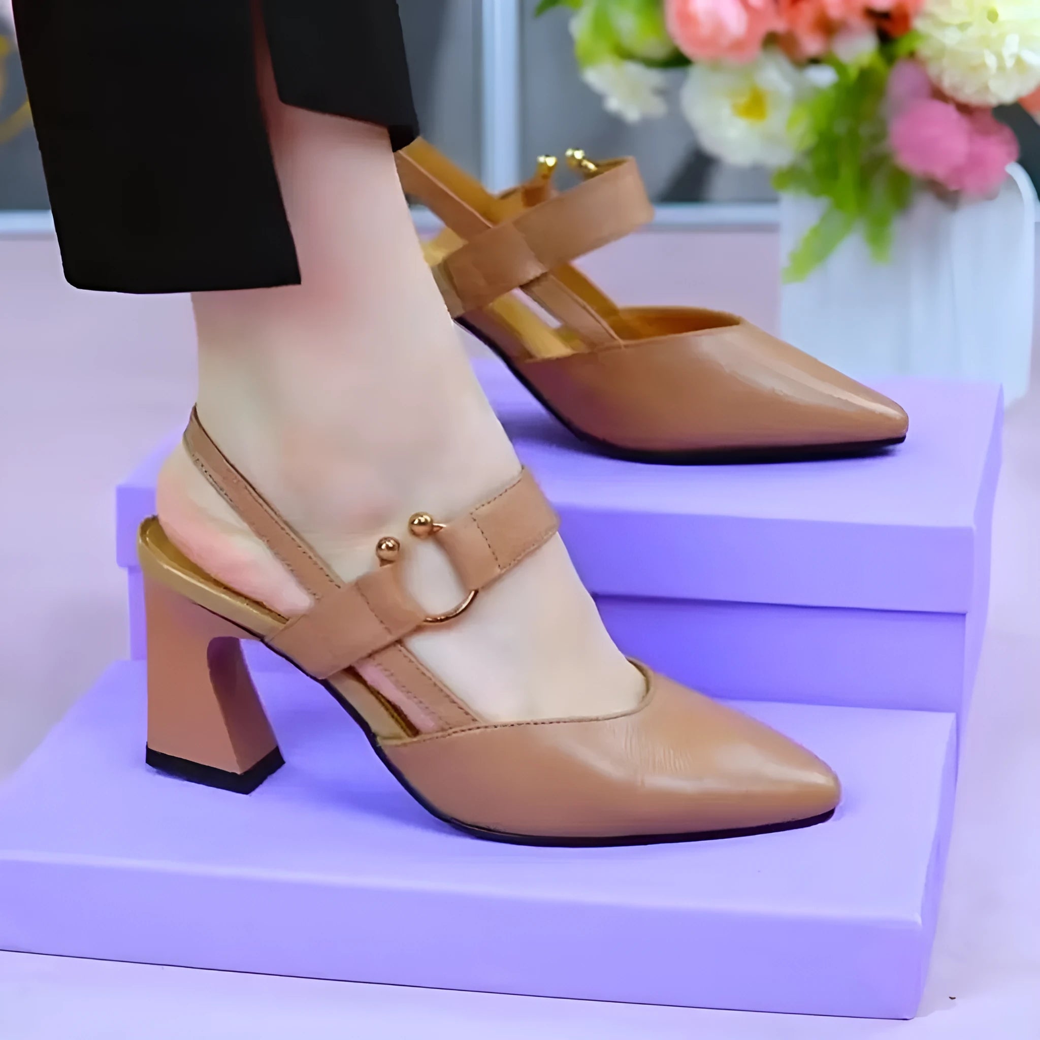 Women's apricot coloured leather closed toe sandals with a chunky heel on a white background.
