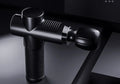 Black USB fascia gun with silicone and ABS construction, compact 382 g muscle fitness equipment