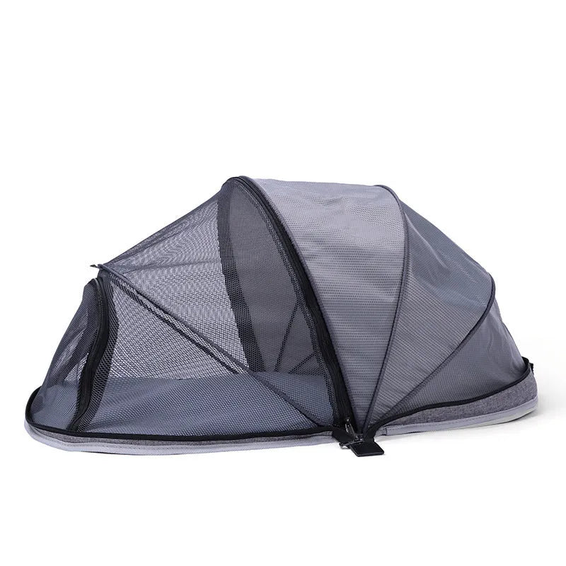 Portable black and mesh folding tent for cats shown set up as a pet bed and travel cage.