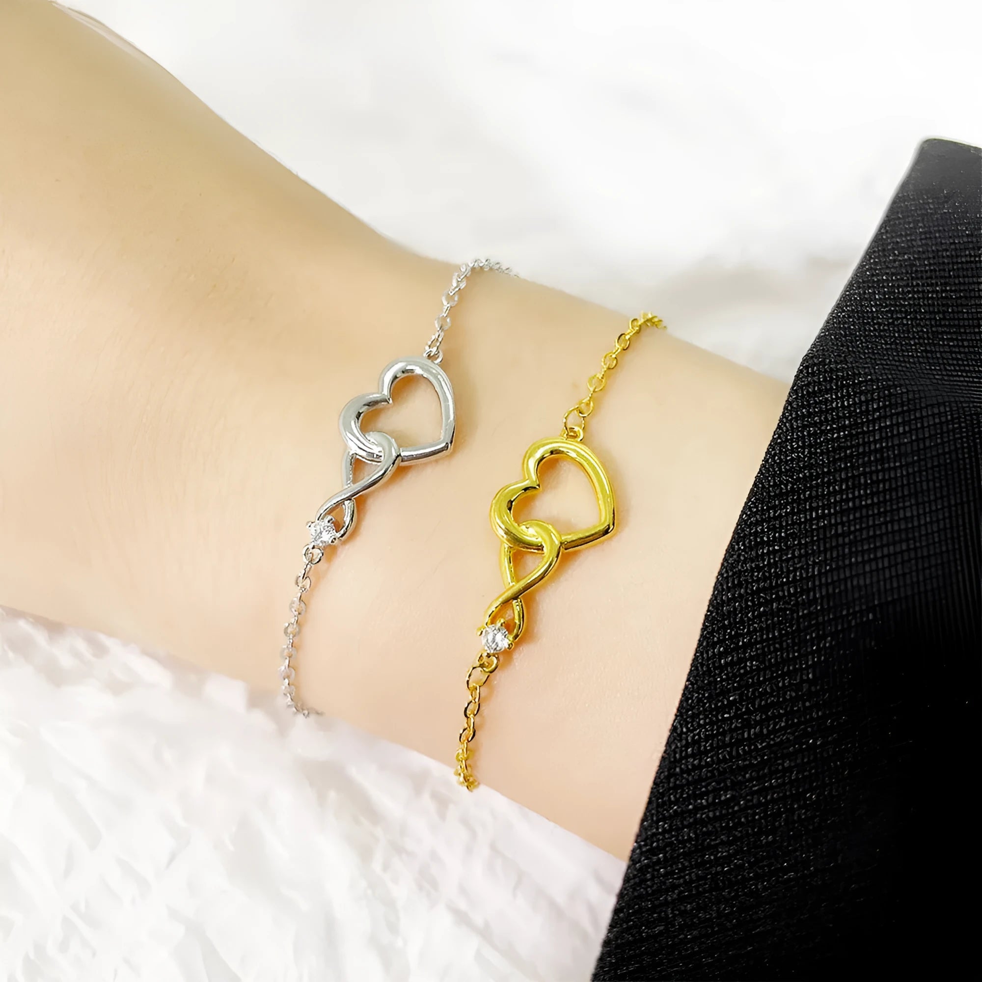 Heart-shape copper bracelet with clear 3A zirconia stone on adjustable chain in platinum finish