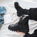 Men's black platform Dr Martens ankle boots with a zipper, showing the frosted leather and rubber sole.