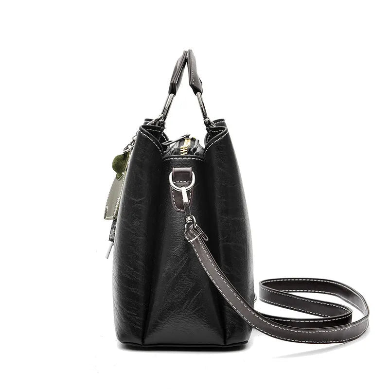 Simple Retro small horizontal square PU crossbody handbag for women in black with outer slit pocket