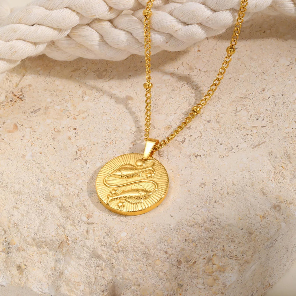 Stainless steel zodiac necklace with cross chain design and embossed constellation pendant