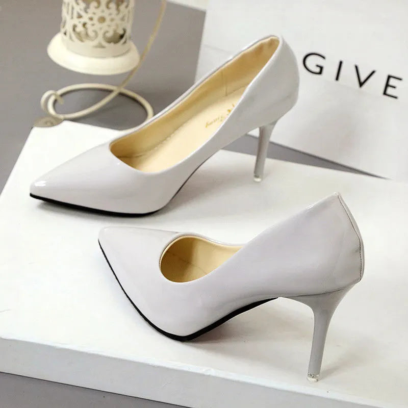 Ladies pointed stiletto pumps in white with super high heel above 8cm and artificial PU upper