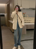Korean style solid colour polyester suit jacket with long sleeves and pocket detailing.