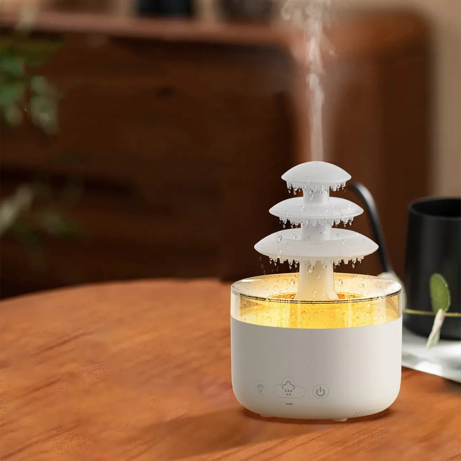 White Cloud Rain air humidifier and essential oil diffuser with colourful LED lights on a wooden table.