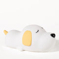 Silicone cartoon dog night lamp in two colours with a USB charging cable.