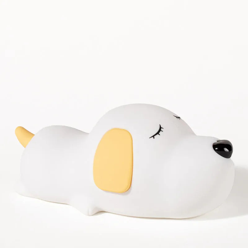 Silicone cartoon dog night lamp in two colours with a USB charging cable.