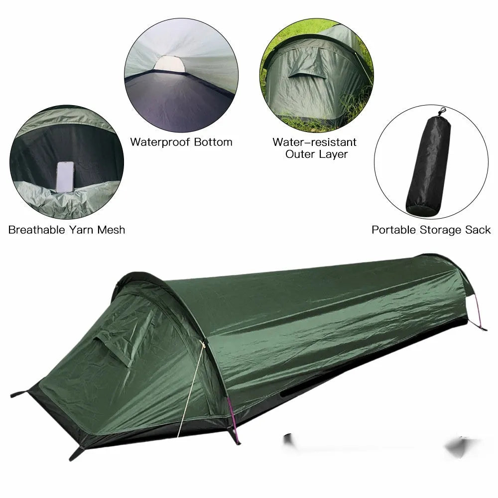 Single person sleeping bag tent in army green set up outdoors, showing rain fly and aluminium rod poles.