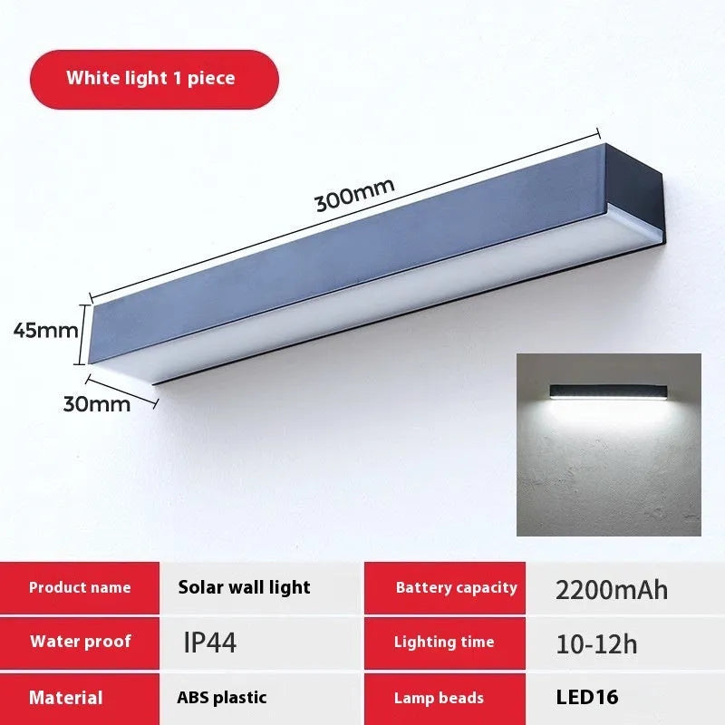 Black solar-powered outdoor wall lamp with strip design for garden and yard lighting