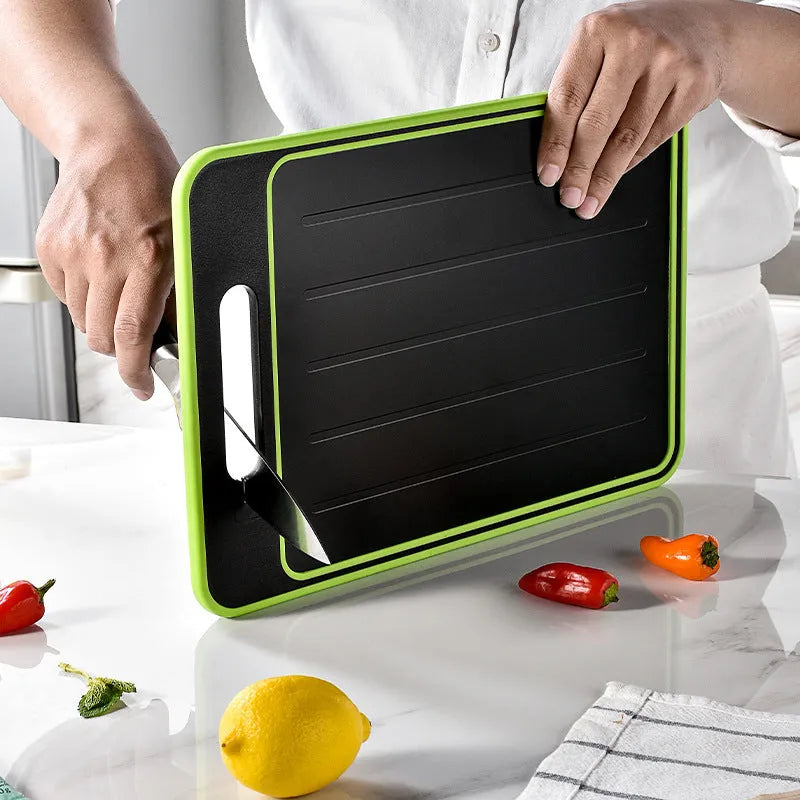 Grey square aluminium cutting board with double-sided design showing thawing surface and integrated knife sharpener