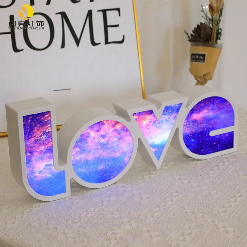 LED LOVE light decoration with rainbow-style lampshade showing romantic room illumination