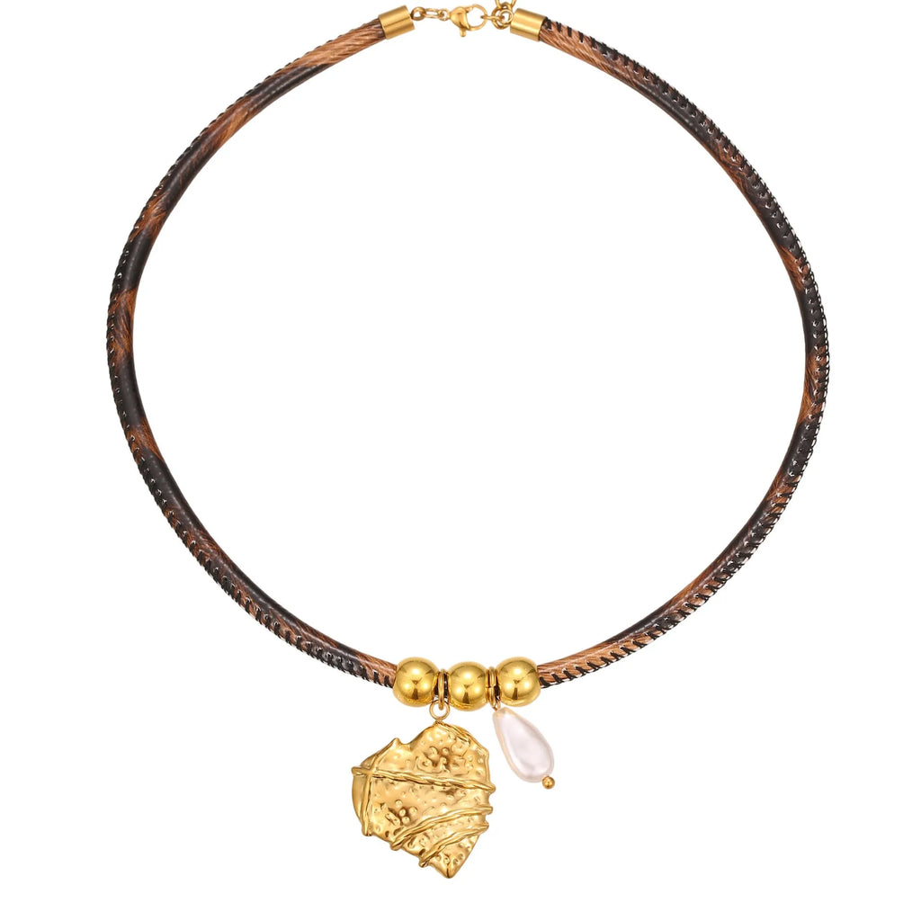 Geometric stainless steel necklace with leopard leather accents on pendant and gold-plated chain