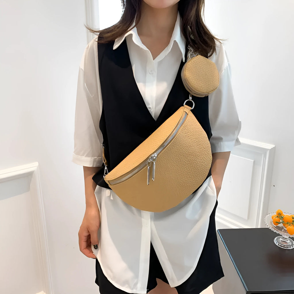 Women's solid colour PU crossbody bag with clamshell design and single shoulder strap.