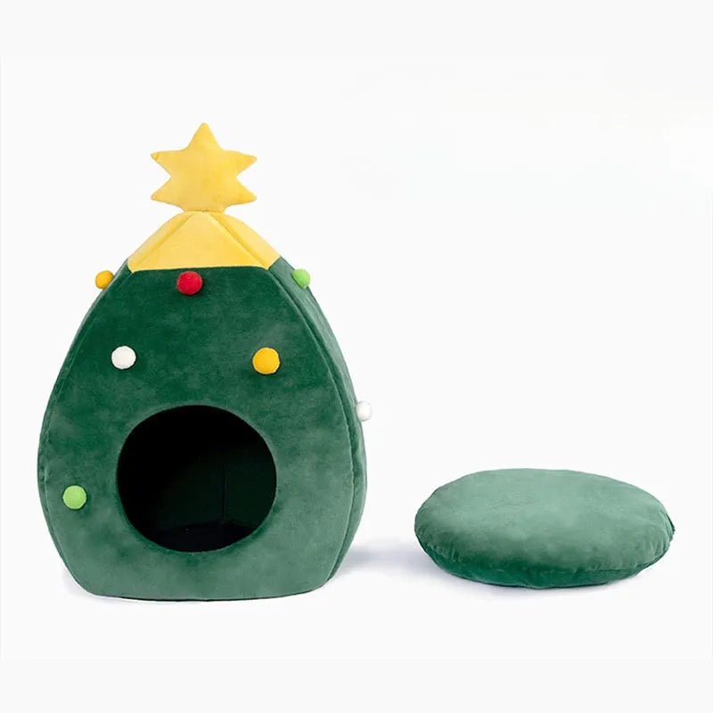 Red Christmas tree shaped plush cave bed for cats and small dogs on a wooden floor