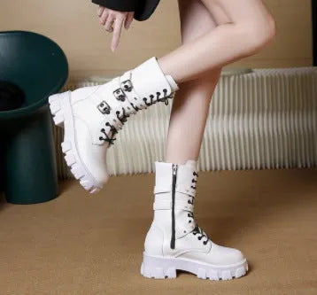 Black women's mid-calf knight boots with a metal buckle and side zip on a white background.
