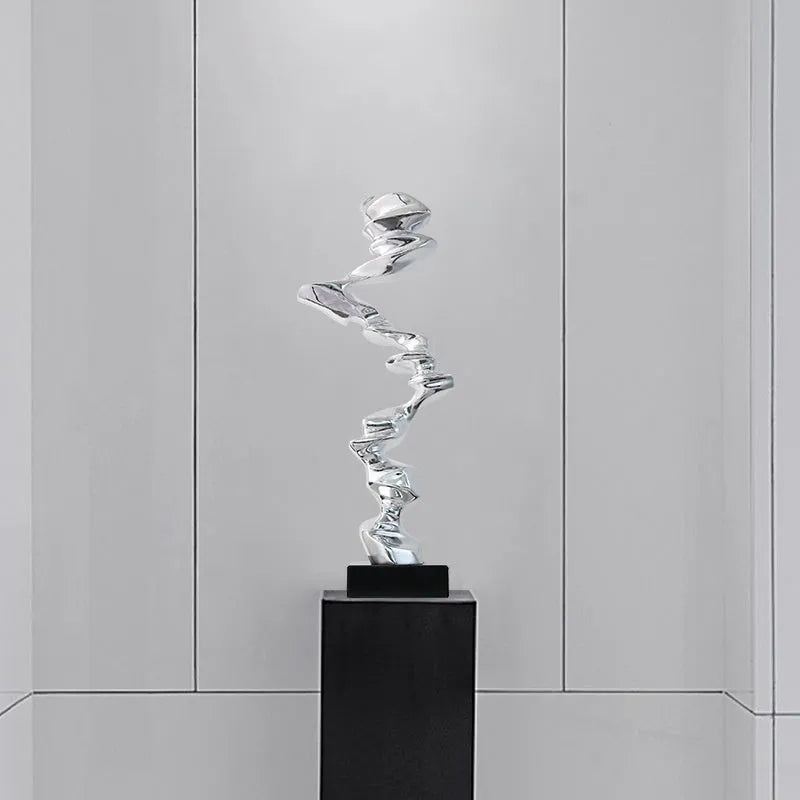 Abstract resin ornament in modern style with metallic finish for hallway or living room decoration