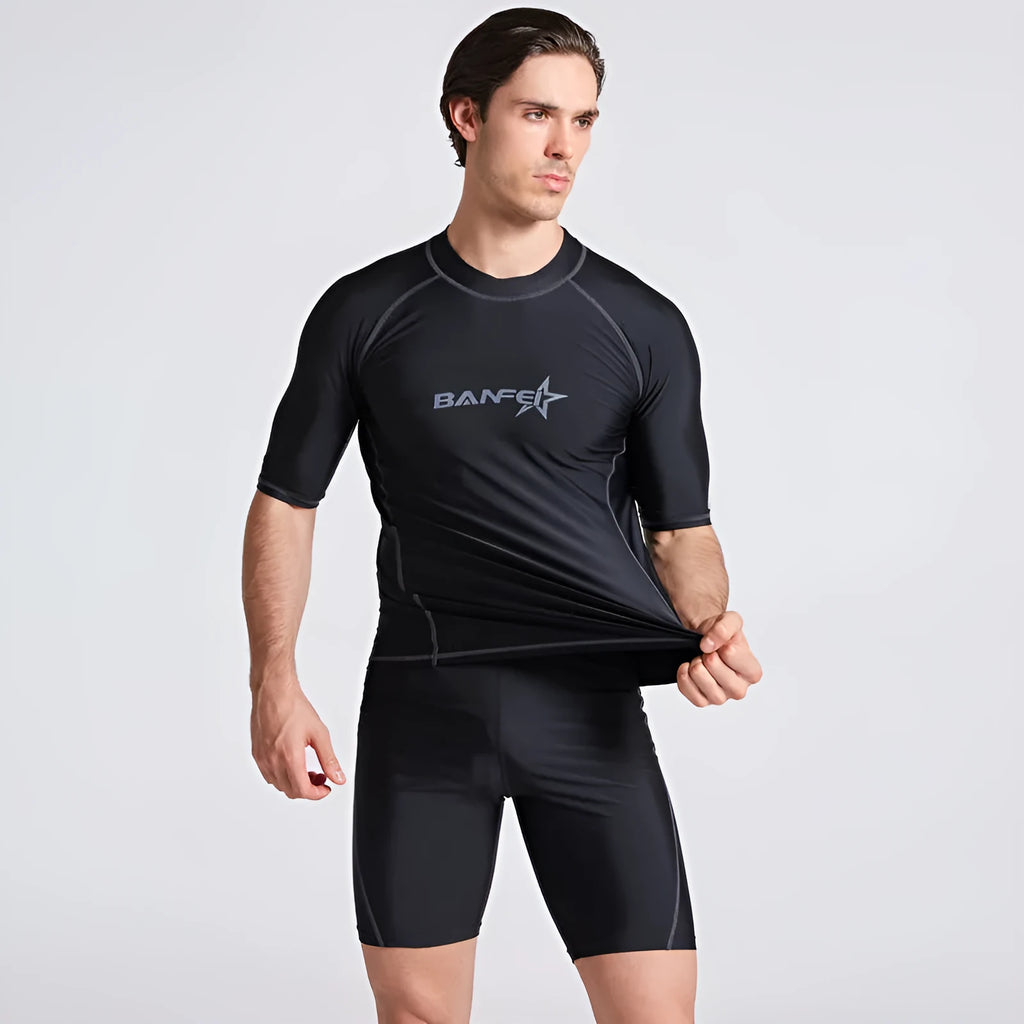 Men's half sleeve nylon swim suit top and pants set on a white background
