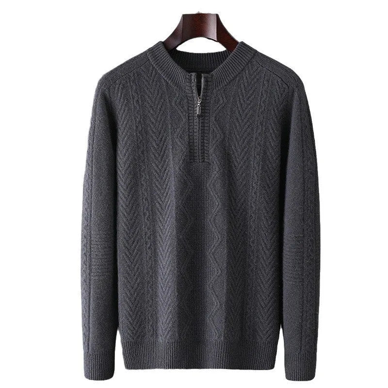 Man wearing a grey diamond pattern wool pullover sweater with a half-zip neck.