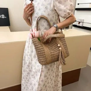 Women's portable straw crossbody bag in milky white colour with diagonal woven pattern