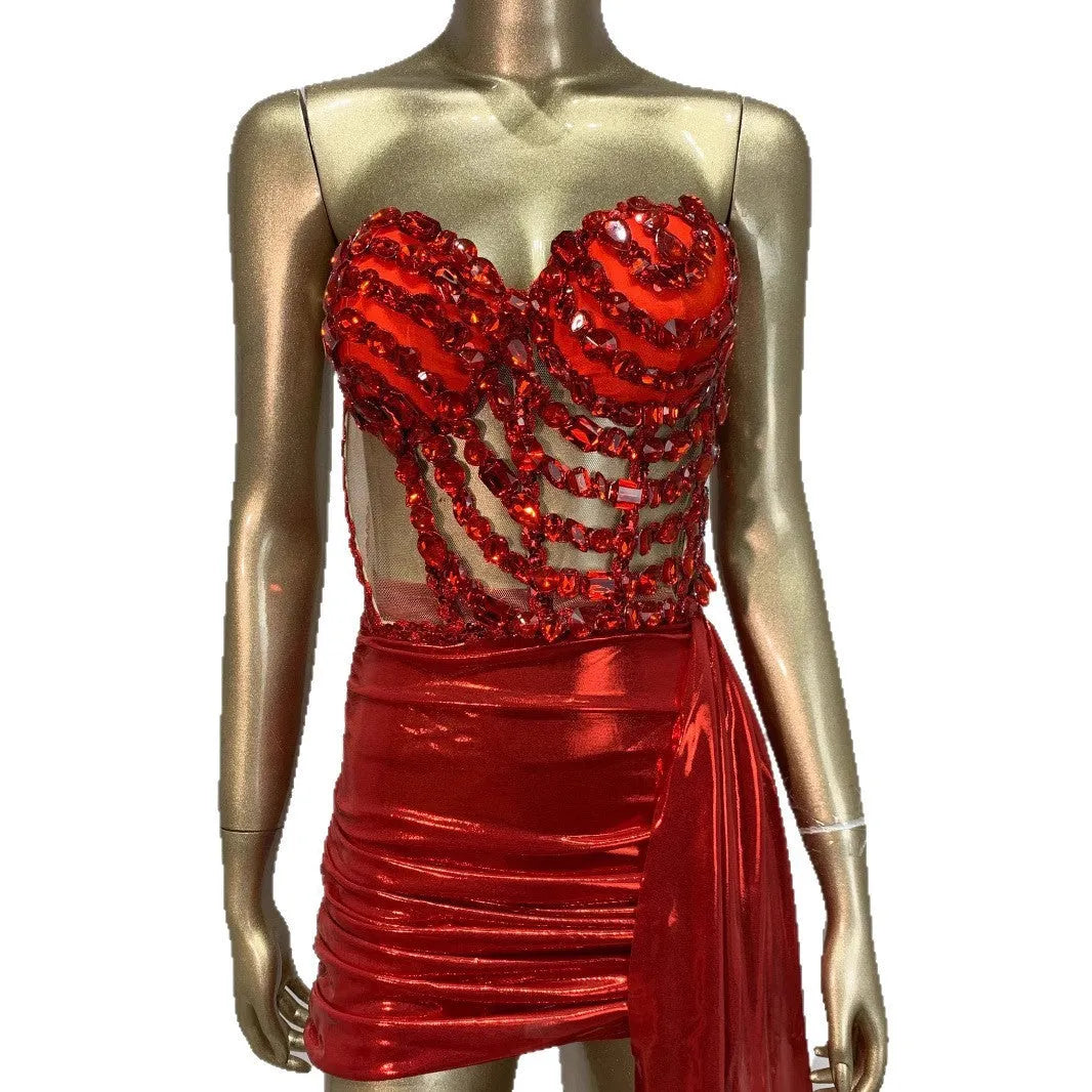 Red women's skirt suit with see-through mesh panels, a stage and party costume in stretch spandex.