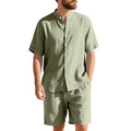 Men's light blue linen blend summer suit with short sleeves and shorts on a hanger.