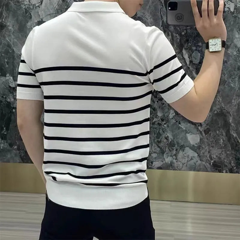 Man wearing a black and white striped knit t-shirt with a lapel collar, casual pullover style.
