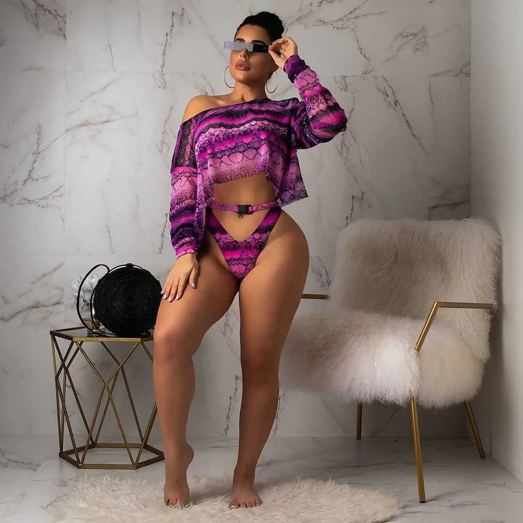 Women's purple snakeskin floral print long-sleeve swimsuit top and matching bikini bottoms.
