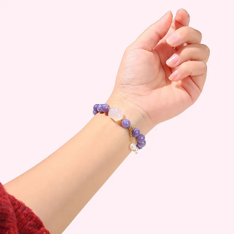 Purple geometric bracelet with aquamarine and lychee jelly agate beads in 6mm, 8mm, and 12x16mm sizes.