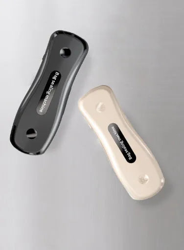 Small USB rechargeable sealing machine in milky white colour with magnetic storage patches