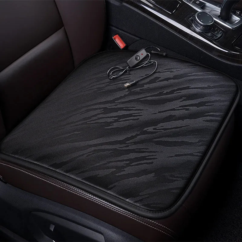 Car heating square cushion in black, approximately 45x45 cm, with USB cable and switch.