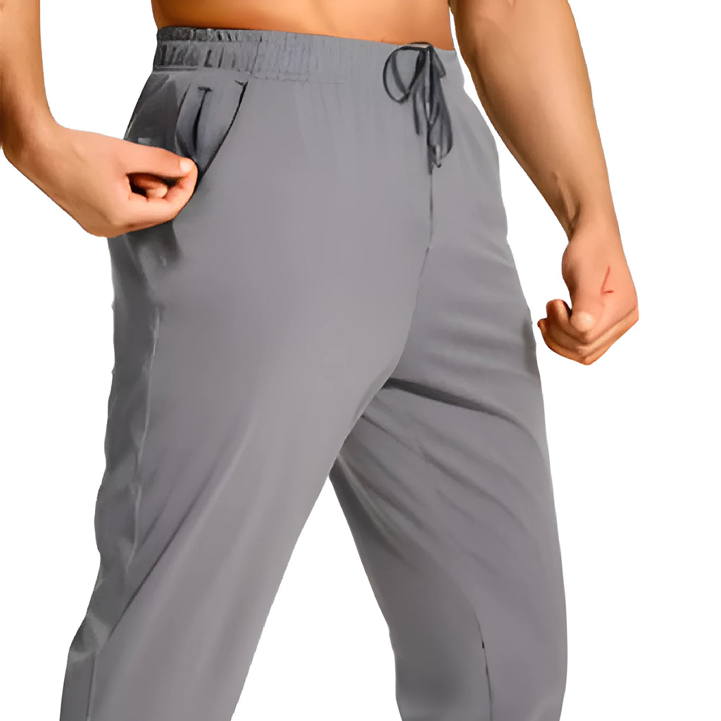 Men's solid-colour loose casual trousers in polyester fabric, shown in one of twelve available colour codes.