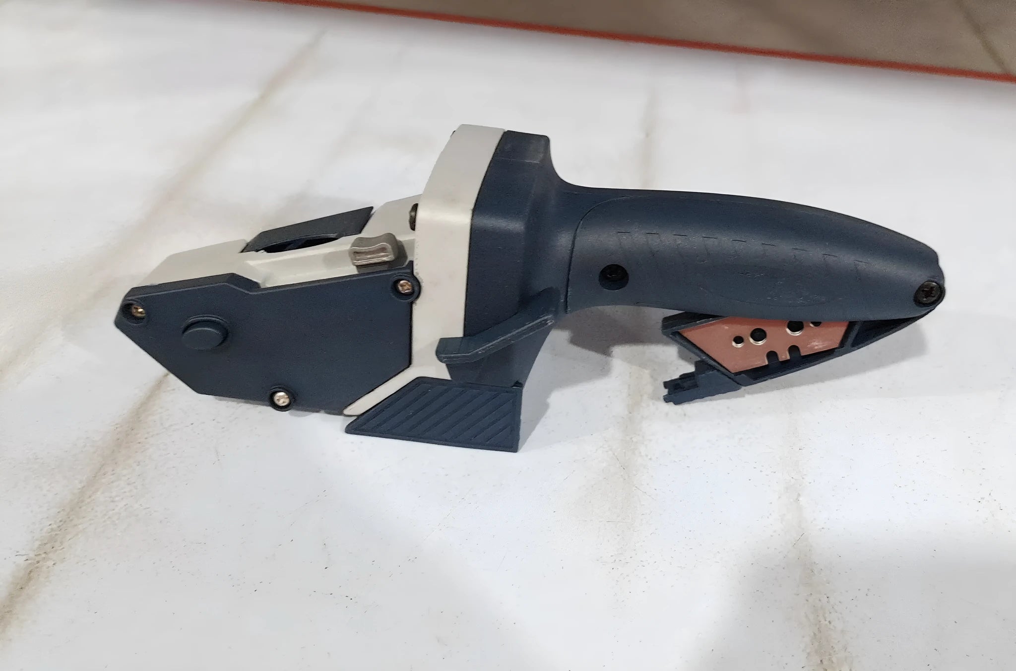 Blue multifunctional woodworking cutter with tape measure and one-press lock for precise material cutting