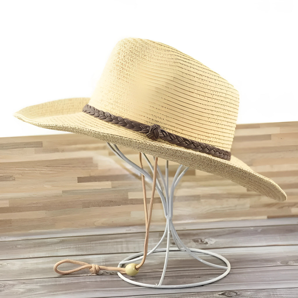 A foldable straw sun hat for men with a wide brim, shown in a beige colour.