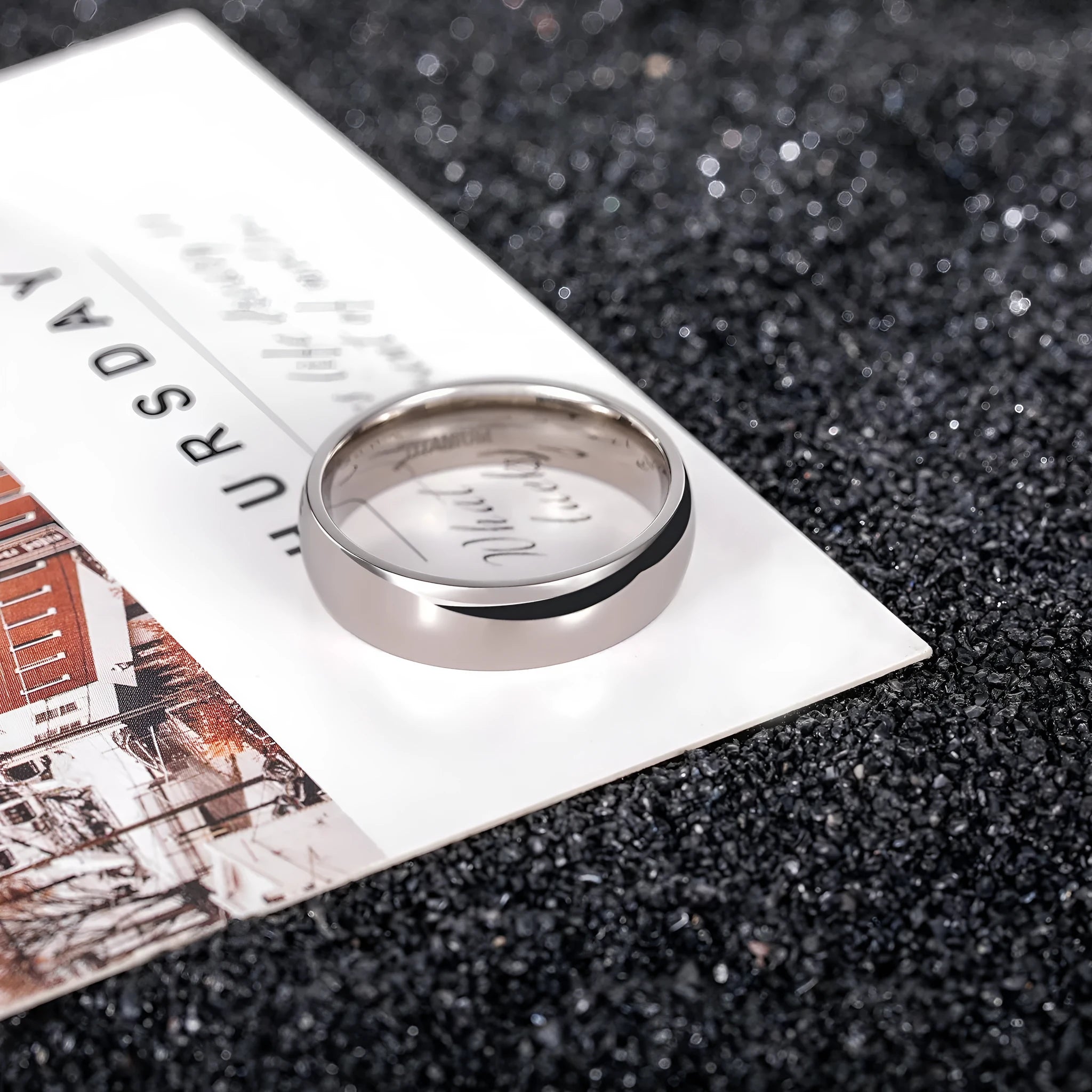 A simple silver-coloured titanium steel ring showing three width options: slim 2mm, standard 4mm, and wider 6mm band.
