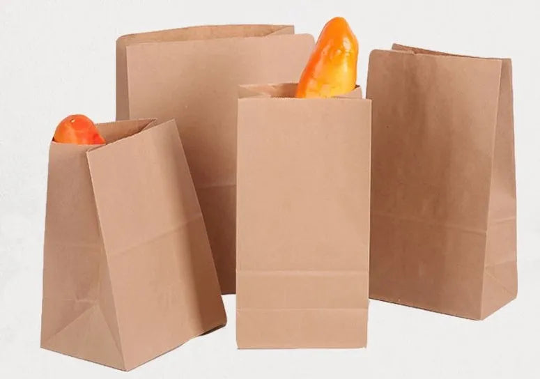 Yellow kraft paper tin foil bag with inner aluminium layer for snack food packaging.