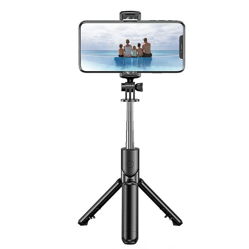 Black selfie stick tripod with wireless Bluetooth remote, universal phone holder, and optional ribbon fill light