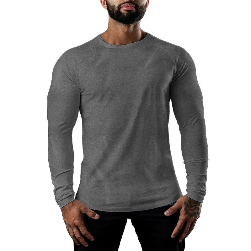 Men's tight-fitting long sleeve cotton sports T-shirt in grey, worn for gym training.