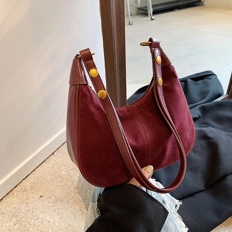 Retro commuter crossbody bag in PU with oval shape and three-dimensional pocket, shown in black, wine red, dark brown, or brown.