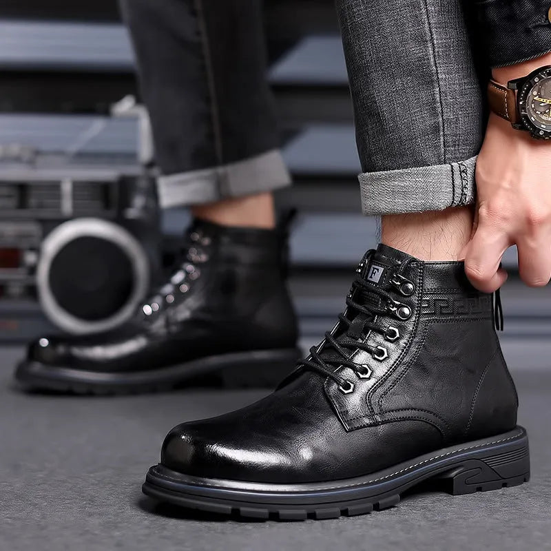 Black and brown leather Martin ankle boots with a rubber sole and visible stitching.