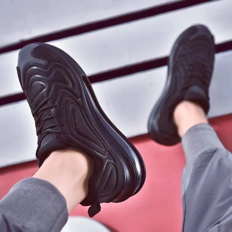 Men's black casual sneakers with lace-up front and a thick air cushion sole.