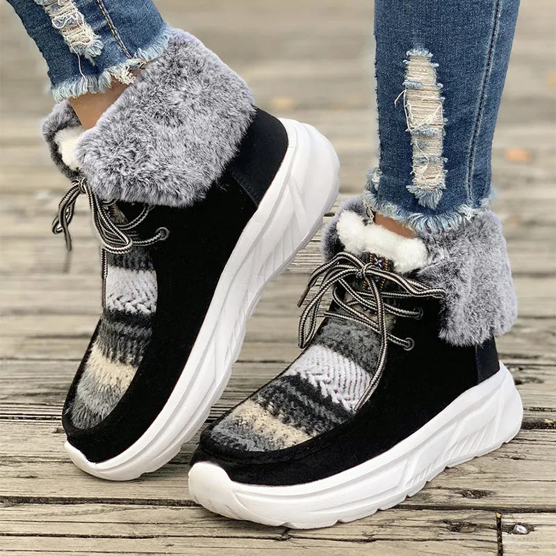 Women's beige fuzzy suede lace-up snow boots with thick rubber sole and plush lining.