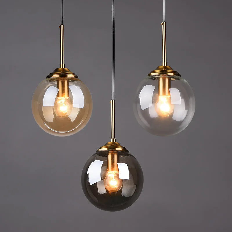 Modern round glass ball chandelier ceiling light in Nordic style with spherical shades.