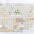 26-piece PBT key cap set with steamed bread design for mechanical keyboards, showing march past colour scheme
