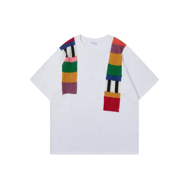 Men's loose grey cotton T-shirt with black and white patchwork letter design on chest.