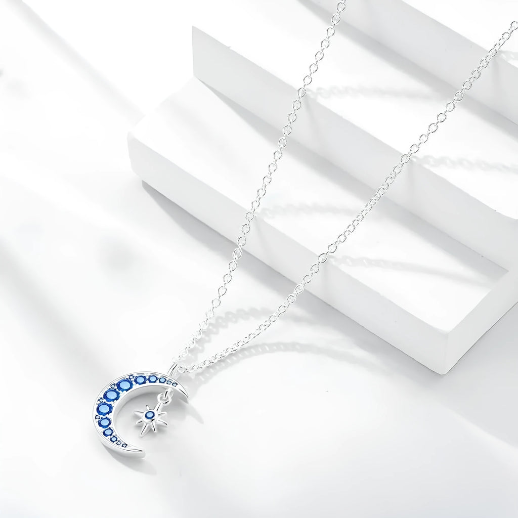 Blue moon pendant necklace with copper geometric pendant, white gold colour finish, and adjustable O-ring chain