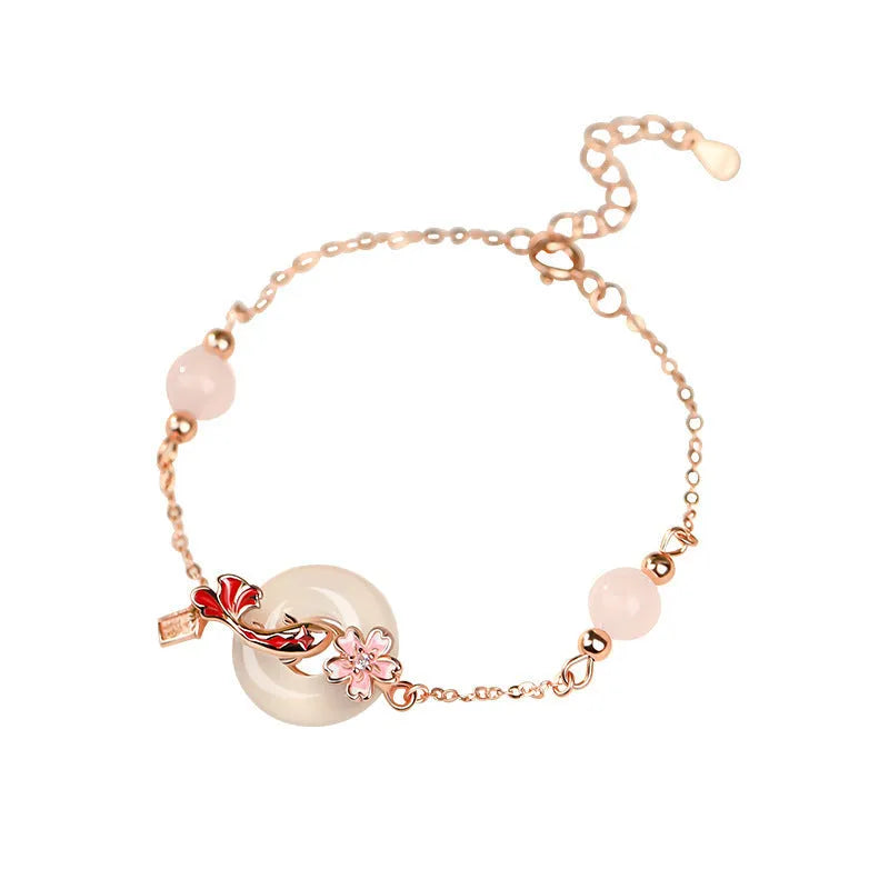 Sterling silver bracelet with white chalcedony crystals and electroplated koi pattern design
